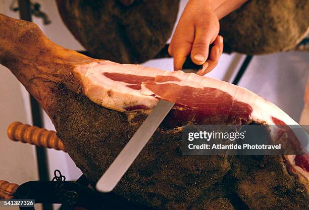 butcher slicing prosciutto - prosciutto stock pictures, royalty-free photos & images