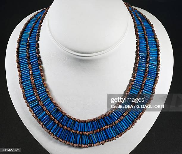 Necklace made from blue cylindrical beads and majolica beads. Egyptian civilisation, Middle Kingdom, 2040-1650 BC.