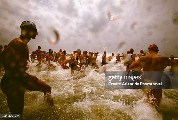 swimming start during the 2001 viareggio triathlon - beginner triathlon stock pictures, royalty-free photos & images