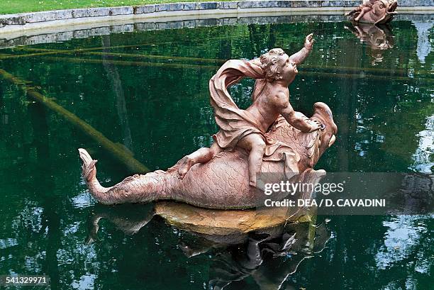 Cherub riding a dolphin, fountain of Fame, the gardens of the Royal Palace of La Granja de San Ildefonso, 18th century, Castile-Leon, Spain.