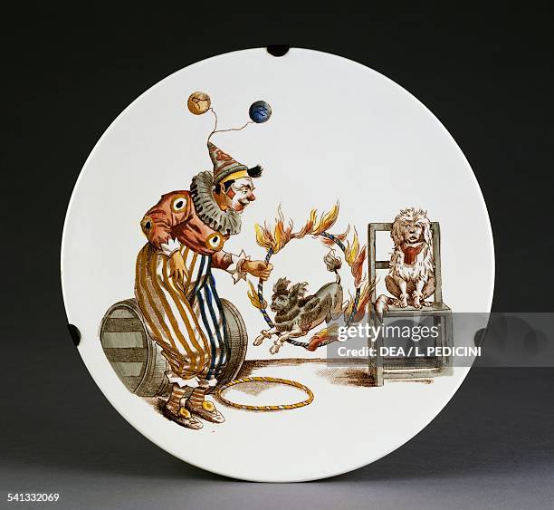 Puppy jumping through a ring of fire, Pagliacci dishes set, 1930-1940, porcelain, diameter 21.5 cm, made by Richard ceramics company. Italy, 20th...