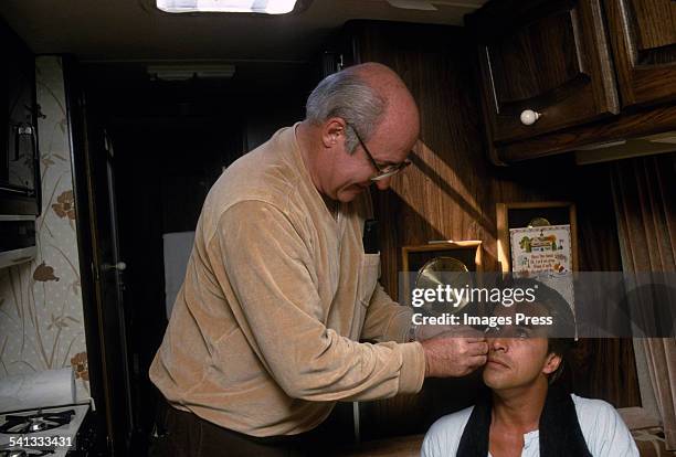 Don Johnson gets make-up put on by Vince Callaghan prior to filming an episode of Miami Vice circa 1985 in Miami, Florida.