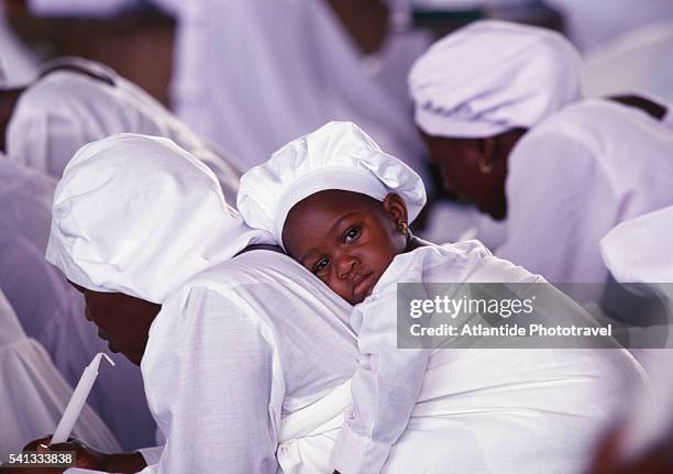 child during a service in the cite celeste of togo church - lome stock pictures, royalty-free photos & images