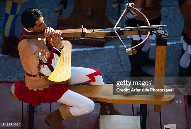 crossbow archer in traditional dress - massa marittima bildbanksfoton och bilder