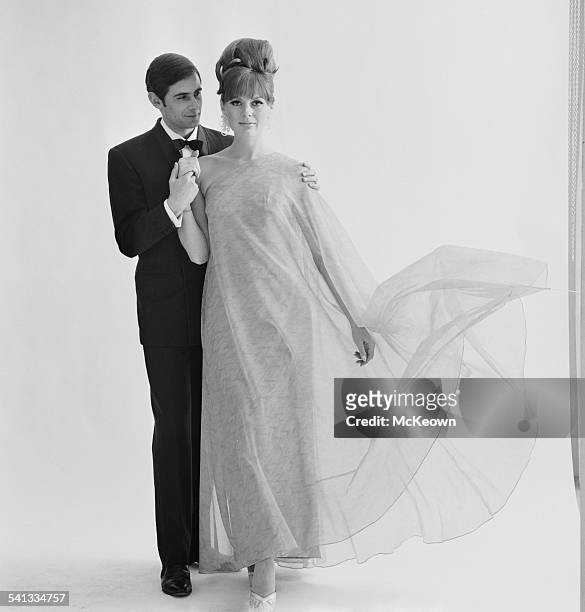 Fashion model Paulene Stone shows a long evening dress in nylon organza by Jean Allen, 15th March 1967.
