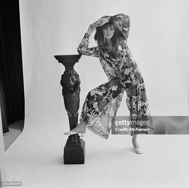 Fashion model Paulene Stone shows a trouser dress by Nettie Vogues and hairstyle by Alexandra, 15th March 1967.