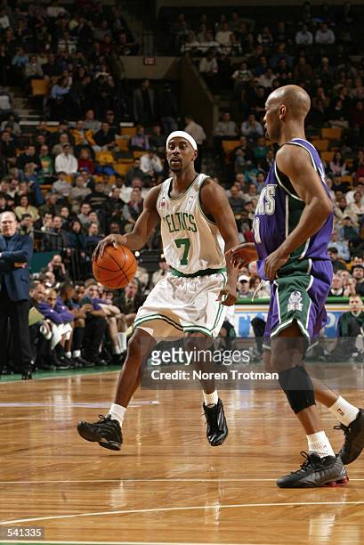 Point guard Kenny Anderson of the Boston Celtics drives past point guard Sam Cassell of the Milwaukee Bucks during the NBA game at the FleetCenter in...