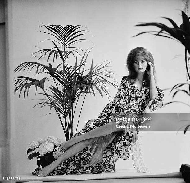 English fashion model Paulene Stone shows a muumuu dress in cotton muslin print, 13th March 1967.