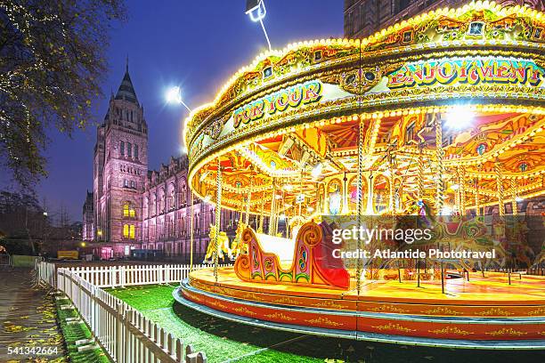 a roundabout near the natural history museum, on the background, during the christmas period - natural history museum london stock pictures, royalty-free photos & images