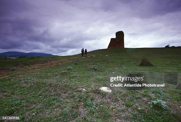 people walking towards statue - nagorno karabakh stock pictures, royalty-free photos & images