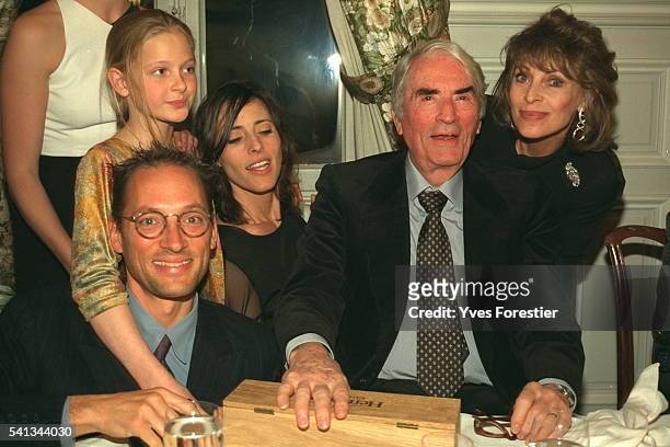 Gregory Peck sits among his family at a birthday celebration in France. Beside him is his wife Veronique and son Tony, and daughter Cecilia. Also...