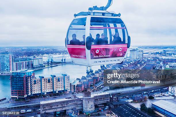 the emirates air line (london's cable car) and the royal docks - overhead cable car stock pictures, royalty-free photos & images