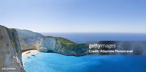 shipwreck beach and headland - promontorio foto e immagini stock