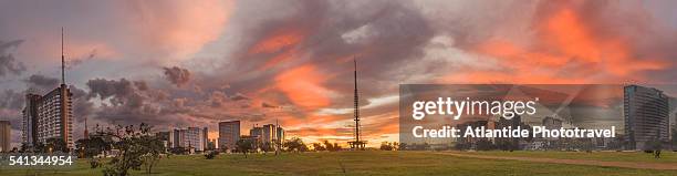 the brasilia tv tower and some buildings at the sunset - brasilia stock pictures, royalty-free photos & images