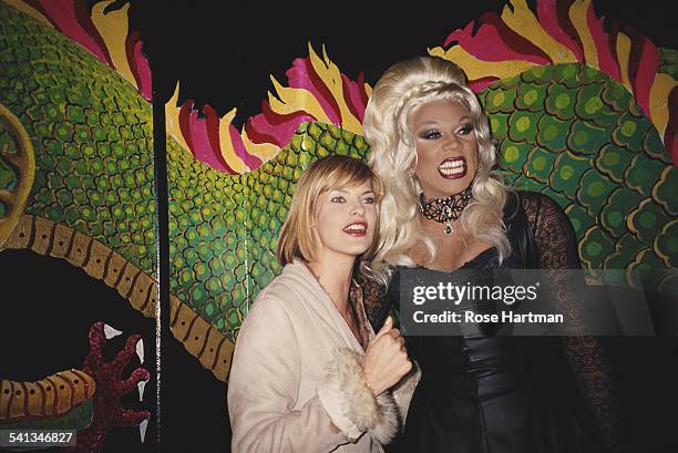 Fashion model Linda Evangelista with RuPaul at an 'Out' magazine party, 1992.