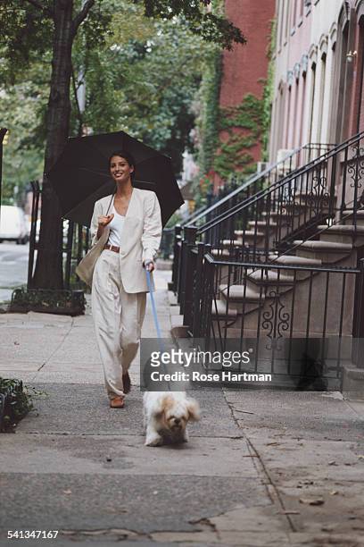 American fashion model Christy Turlington wearing Michael Kors for a fashion shoot on Charles Street, New York City, 1992.