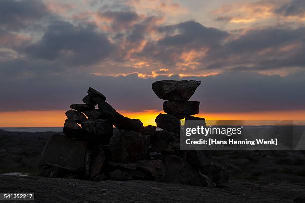 stone symbol with setting sun - stack of sun lounges stock pictures, royalty-free photos & images