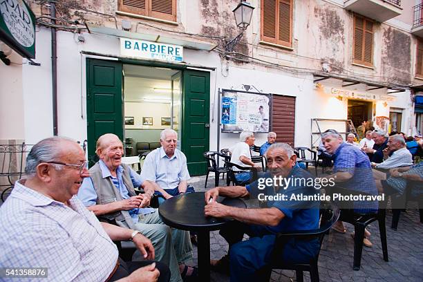 men at sidewalk cafe in pisciotta - pisciotta stock-fotos und bilder