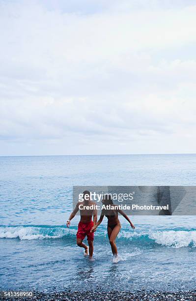 couple on beach between pisciotta and palinuro - pisciotta stock-fotos und bilder