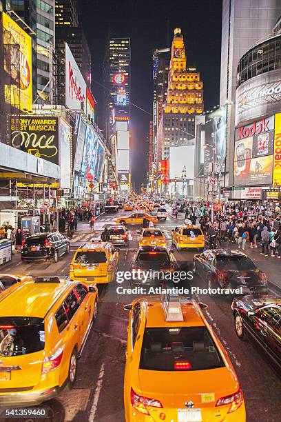 7th avenue at times square - new york taxi stock pictures, royalty-free photos & images