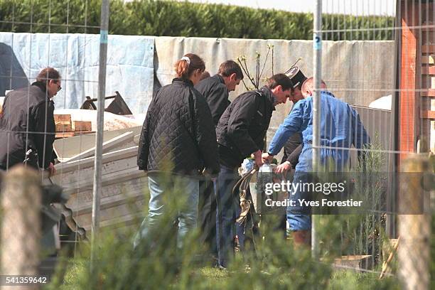 Officers recover various objects found where Marylene Roussey was said to be buried.