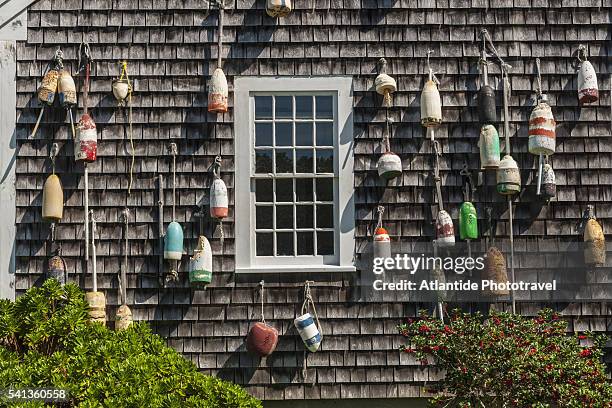 house with lobster buoys - cape cod photos et images de collection