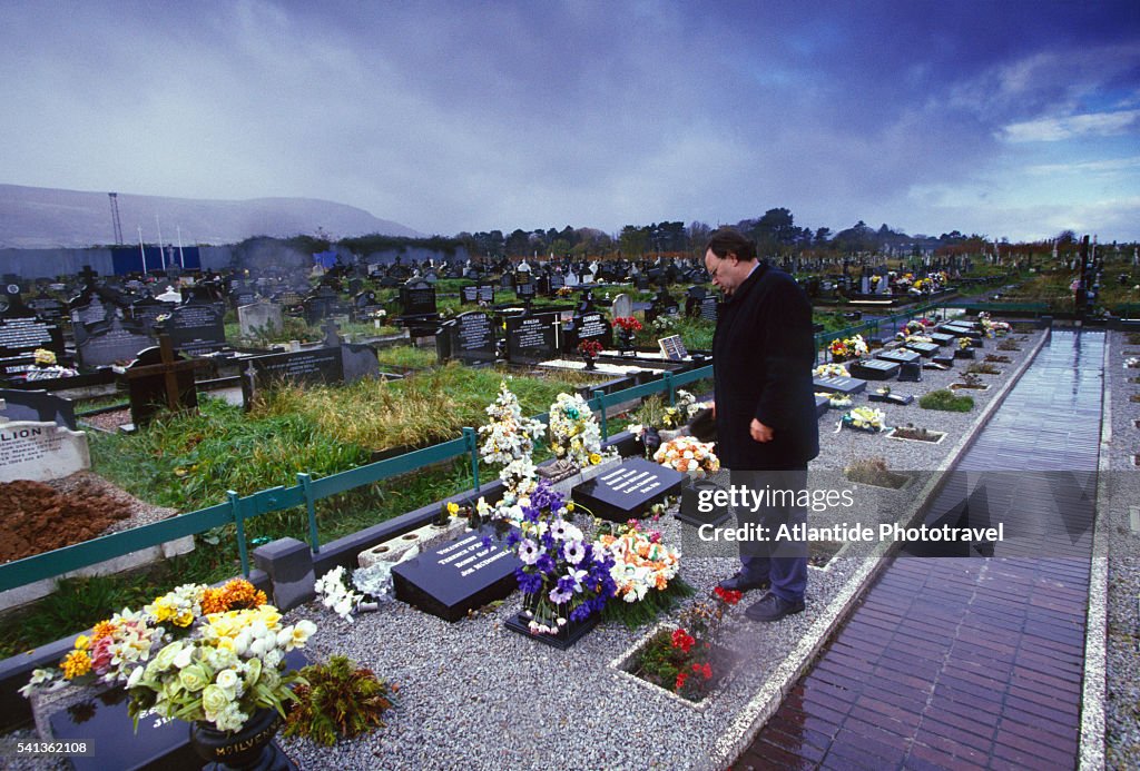 Mourner in Milltown Cemetery in Belfast