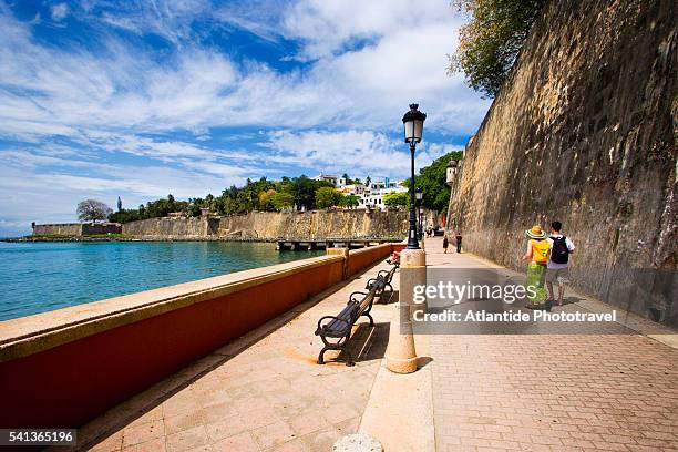 promenade along old san juan city walls - velha san juan imagens e fotografias de stock