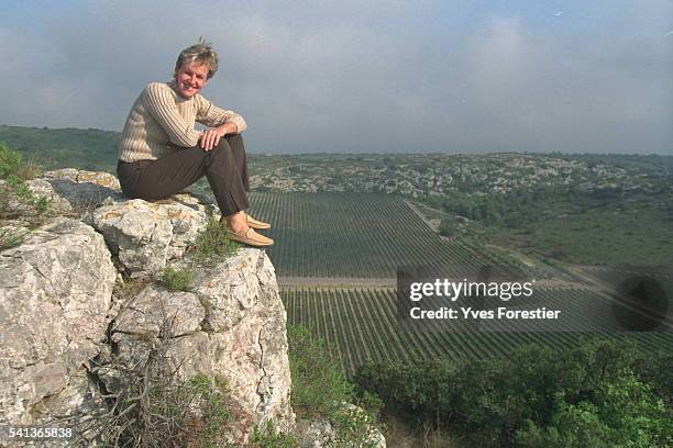 Atrice Buyck-Ribourel seated on the 'wine-grow -er's bench' that overlooks the Hospitalet estate