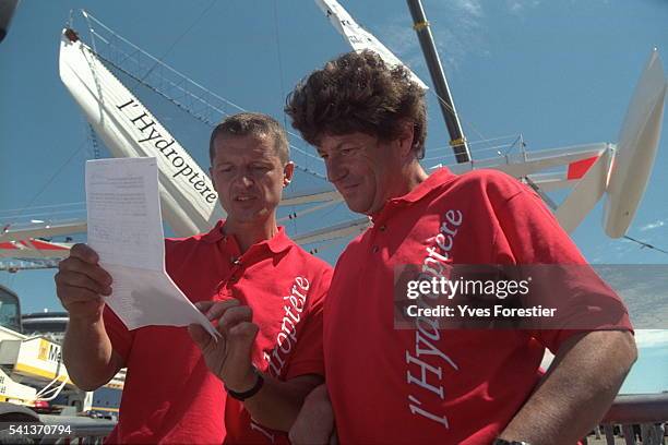 Alain Th{bault, skipper, and Jean Le Cam during the maneuvers.