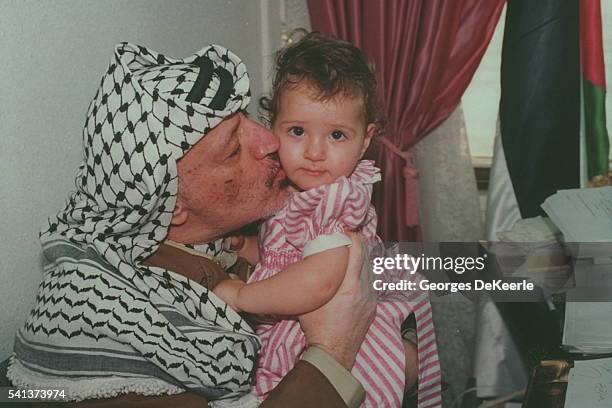 Yasser Arafat and his daughter Zahwa, in Arafat's Gaza City office.