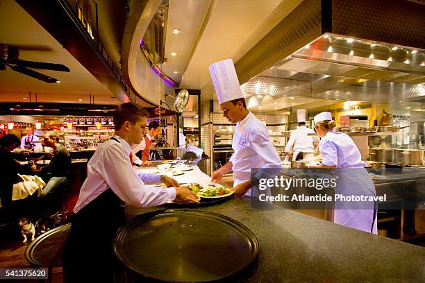 chefs at work in paul bocuse brasserie de l'est - bocuse stock pictures, royalty-free photos & images