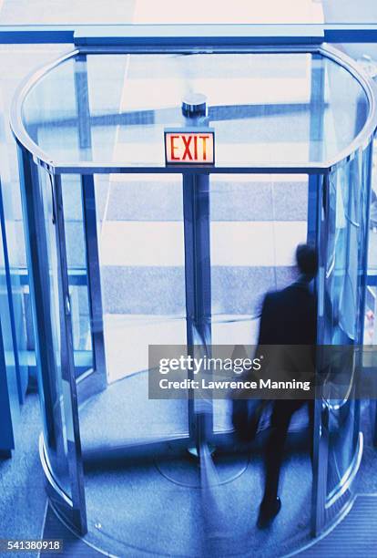 revolving door - revolving door stock pictures, royalty-free photos & images