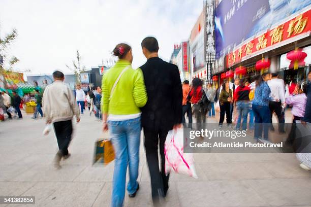 pedestrians on wangfujing dajie - wangfujing stock pictures, royalty-free photos & images