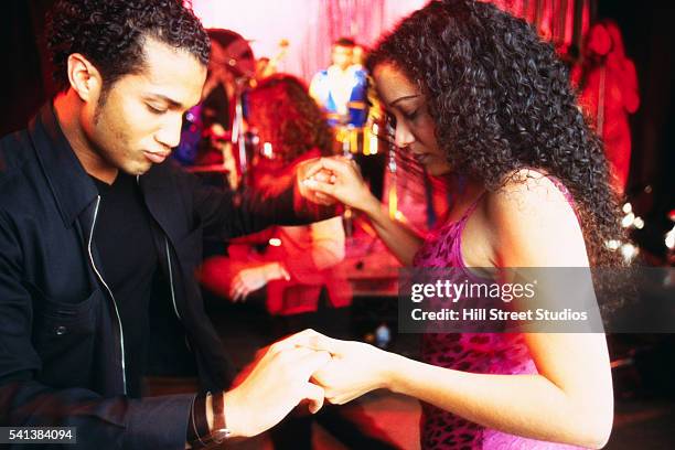 couple dancing at nightclub - salsa lateinamerikanischer tanz stock-fotos und bilder