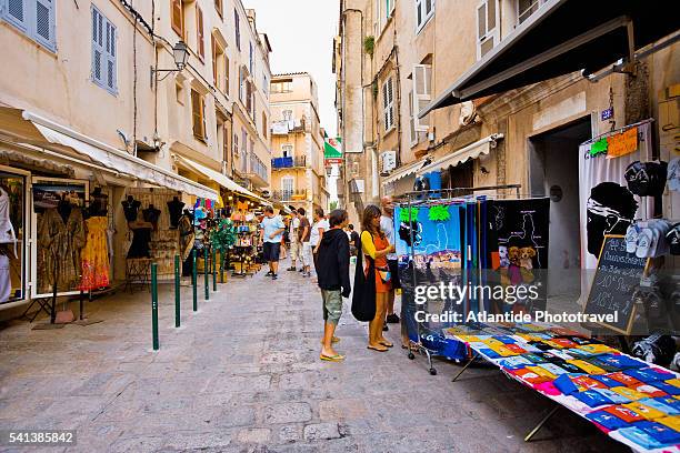 shoppers on the main street in bonifacio - bonifacio stock pictures, royalty-free photos & images