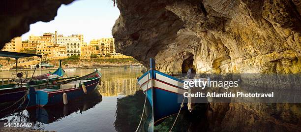 boat in natural cave near xlendi - gozo stock-fotos und bilder