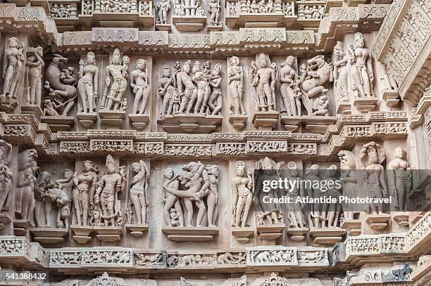 erotic figures carved in sandstone at the lakshmana temple - khajuraho stock pictures, royalty-free photos & images