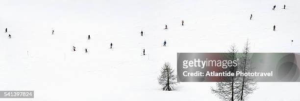 skiers at ski area near colfosco in the dolomites - colfosco stockfoto's en -beelden