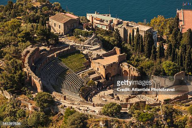 aerial view over 'teatro antico di taormina' (the greek theatre) - teatro antico stock pictures, royalty-free photos & images