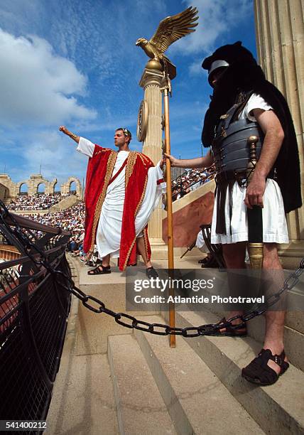 performers in the amphitheater at puy du fou theme park - fou stock pictures, royalty-free photos & images