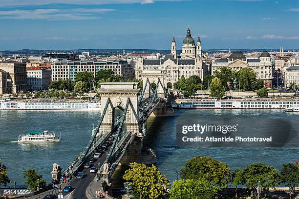 river danube, chain bridge (szechenyi lanchid), gresham palace (gresham palota), st. stephen's basilica and the town of pest - basilica of st stephen budapest stock pictures, royalty-free photos & images