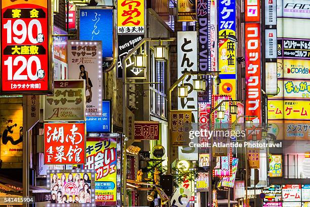 east shinjuku, kabukicho, signs in the red light district - shinjuku stock pictures, royalty-free photos & images