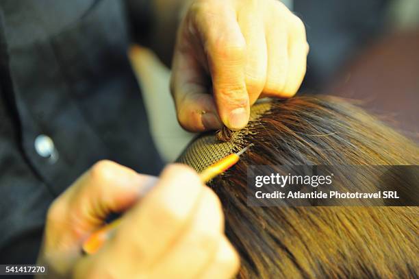 wig maker at work - wig maker stock pictures, royalty-free photos & images
