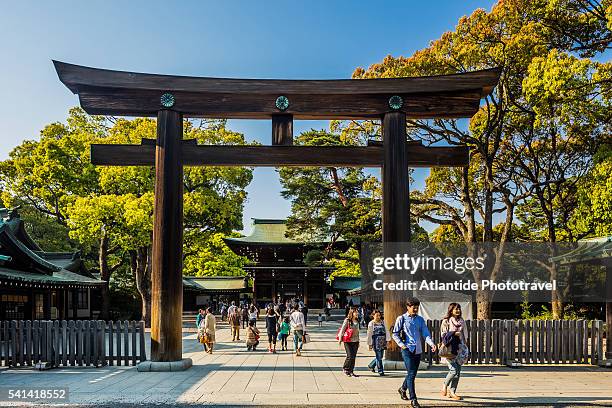 harajuku, meiji-jingu (meiji shrine), the wodden torii (gates) and the shrine - meiji jingu shrine stock pictures, royalty-free photos & images