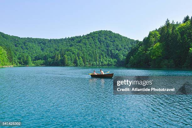 plitvice lakes national park, rowing in the kozjak lake - plitvice stock-fotos und bilder