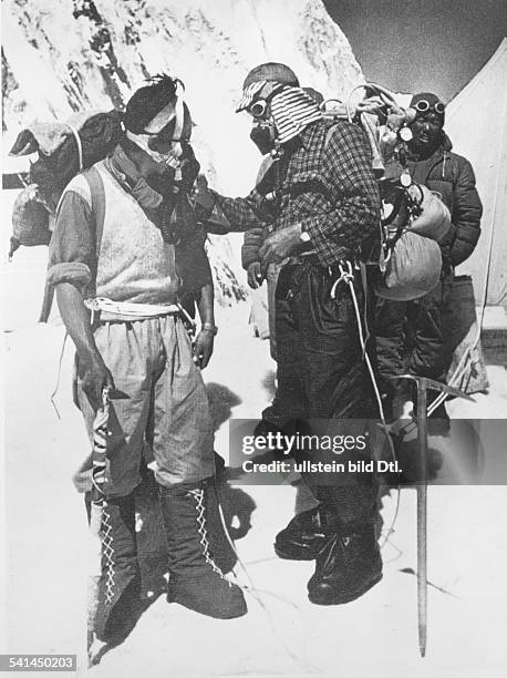 New Zealand mountaineer and explorer. Hillary with the Sherpa guide, Tenzing Norgay, during their successful Mount Everest expedition. Photograph,...