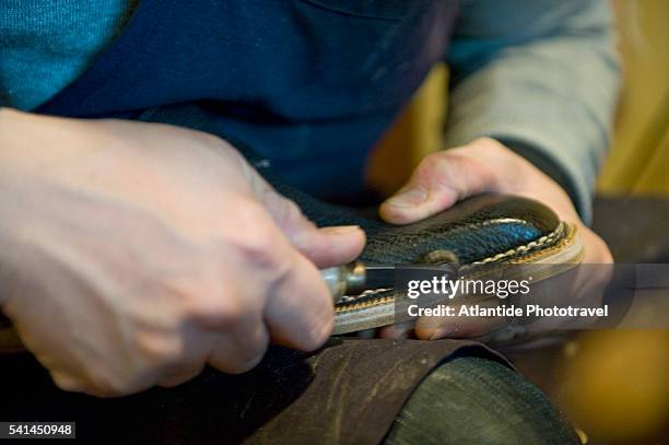 traditional shoemaker roberto ugolini - shoe repair stock-fotos und bilder