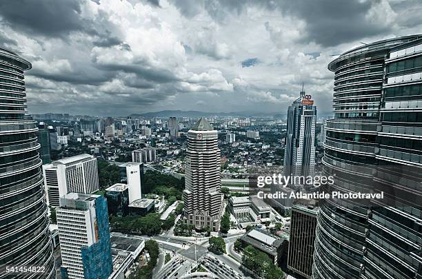 view of the town from the skybridge of petronas towers - skybridge petronas twin towers stock pictures, royalty-free photos & images