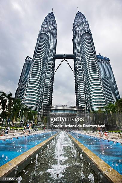 view of petronas towers - skybridge petronas twin towers stock pictures, royalty-free photos & images